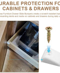 Solid As A Rock Nylon Drawer Bumper Pads With Slick Glide Slide Spacers For Roll Out Shelves Zero Dings On Cabinet Doors Easy Install Includes Mounting Screws in a kitchen drawer with a screw visible.