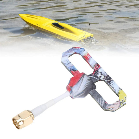 2.4G Omnidirectional SMA Antenna with 4.2dBi Gain for Drone Quadcopter Remote Control, with a RC boat in the background.