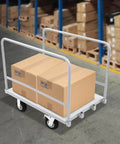 Heavy Duty Platform Truck Cart With Rock Solid Steel Deck And Smooth Roll Casters Built To Shift Two Thousand Pounds Like A Pro Warehouse Workhorse For Daily Hauling Tasks, loaded with boxes in a warehouse.