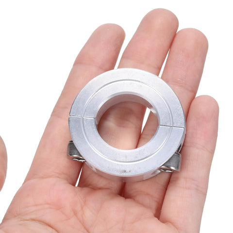Four Pack Heavy Duty Double Split Clamp On Shaft Collar For Seven Eighths Inch Shaft Two Piece Aluminum Alloy Clamping Collar shown in hand
