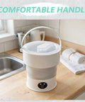 Sweet Compact Folding Mini Washing Machine Portable Travel Washer For Socks Underwear And Delicates Quick Rinse Auto Drain Straight Up Compact Design For Dorms with comfortable handle on kitchen counter.