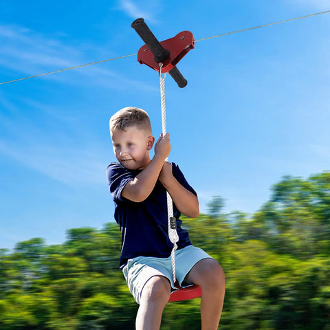 Child using Backyard Zip Line Kit For Kids And Adults, 120 Foot Outdoor Zipline with Swing Seat and Spring Brake.