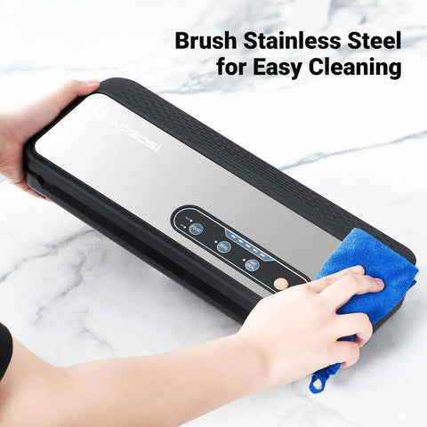 Powerful 90KPa 8-in-1 Food Vacuum Sealer brushed stainless steel surface being cleaned with blue cloth