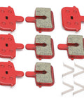 Eight Pack SemiMetallic Disc Brake Pads for Mountain and Electric Bikes with installation clips visible