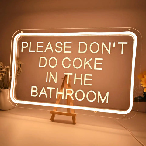 Please Don't Do Coke In The Bathroom LED Neon Sign USB Powered For Bedroom Game Room Bar Or Home Decor 15.8 By 9.8 Inches With 6.6 Ft USB Cord And Dimmer on easel, warm glow