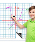 Child uses dry erase marker on Giant Magnetic XY Coordinate Grid Paper for Whiteboards, 26 Inch Square in math classroom.