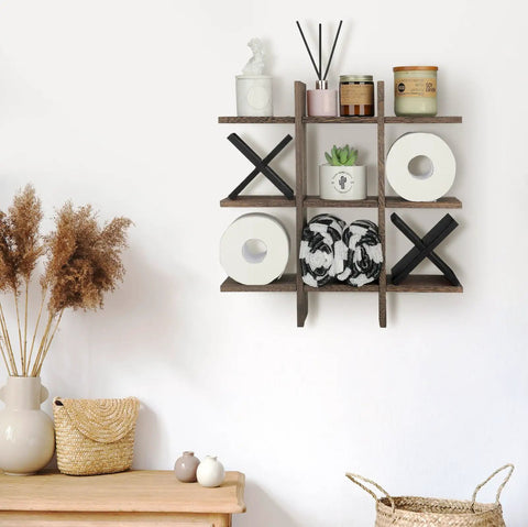 Tic Tac Toe Themed Toilet Paper Holder Stand And Wall Shelf Decor In Rustic Wood with X pieces and tissue rolls.