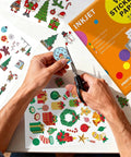 Person cutting festive designs from Pro Grade Clear Vinyl Sticker Paper 30 Sheets Printable Self Adhesive Label Sheets Letter Size 8X11 Inch.