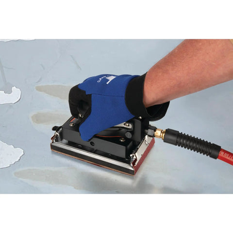 Top Shelf Pneumatic Orbital Sander With Built In Air Regulator And Rubber Over Mold Grip in use on a workshop surface.
