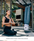 Automatic Ironing Machine 4.0 for Home Use with jeans drying outdoors, next to a woman doing yoga, hands-free wrinkle remover and clothes dryer.