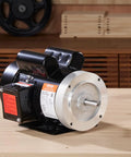 Beast 1.5HP Single Phase Electric Motor 3450 RPM 115 or 230V 56C Frame with Five Eighths Inch Keyed Shaft on workbench