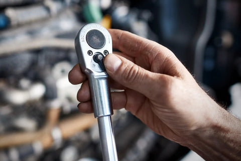 One Half Inch Square Drive Long Reversible Ratchet With 36 Teeth, Chrome Alloy Steel in use showing two component handle