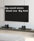 Dual Mode Two Point Zero Studio Monitors for Near Field Music Production on shelf with TV setup, illustrating sound waves.