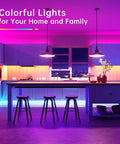 Modern kitchen with 100 Ft RGB LED Strip Lights With 44 Key Remote Multi Color Color Changing LED Tape illuminating cabinets and ceiling