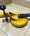 Yellow Floor Gap Fixer Tool with Suction Alignment, adjustable heavy duty 45 degree striking, on tiled floor.