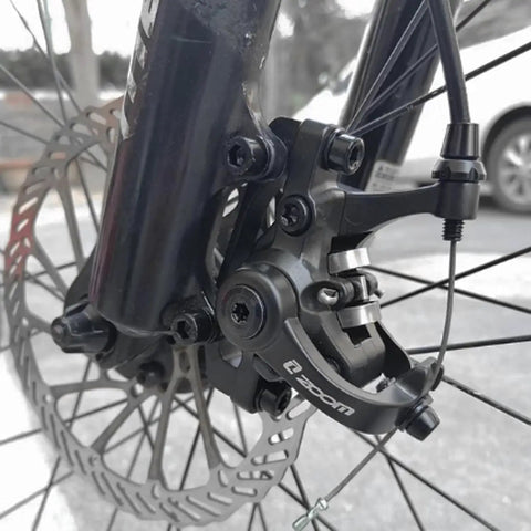 Close-up of black Beefy Dual Piston Caliper Disc Brake Set for mountain bikes with alloy cable line pull brakes