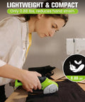 Image of a user handling 4V Cordless Electric Scissors For Cardboard Cutting With 4 Sk5 Blades, cutting fabric on a table.