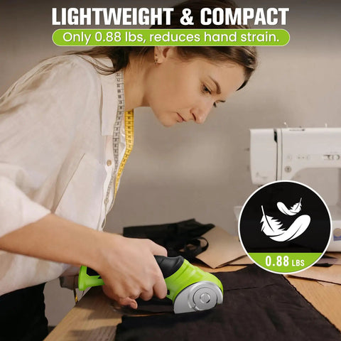 Image of a user handling 4V Cordless Electric Scissors For Cardboard Cutting With 4 Sk5 Blades, cutting fabric on a table.