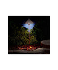 Copper Hammered Roof Path Light With Integrated LED, Outdoor Wet Location Lamp illuminated at night in garden setting