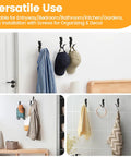 Hella Sturdy Mermaid Cast Iron Hooks, Rustic Black Wall Plant Hangers For Cozy Spaces, heavy-duty hooks holding hats and jackets.