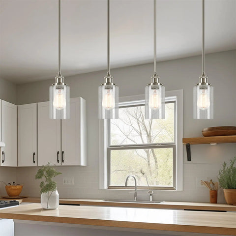 Brentwood Seeded Glass Shades Set hanging in modern kitchen, clear bubble glass, 6.25x4 inch, fits 1-5/8 inch fitter, 3-pack replacements.