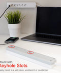 Six Outlet Surge Protector Power Strip Set For Home And Office Use With 10 Ft Cords 800 Joules showing keyhole slots for mounting.