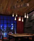Rustic Industrial 8-Light Pendant Chandelier For Dining Room And Kitchen Island, height adjustable over a wooden table.