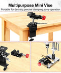 360 Degree Rotating Mini Bench Vise With Quick Release Ratchet Wrench 2.48 Inch clamped on a wooden table