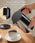 Fast Boil Electric Kettle 1.0L 1200W With 7 Temperature Settings pouring hot water into a cup on a wooden table