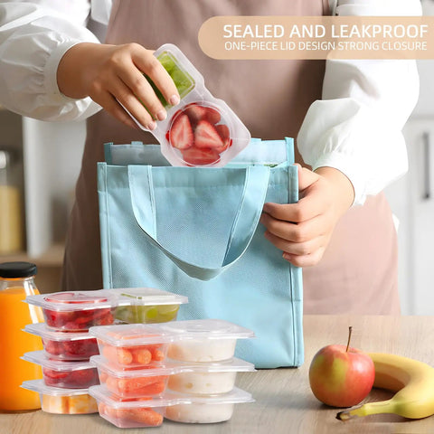 Person placing filled Two Compartment Snack Containers with Lids for Meal Prep into a blue bag, showing stacked containers with fruit.