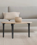 Top Shelf Folding Table Legs 13 8 Inch Rock Solid Metal Collapsible Furniture Stand With Self Locking Design Hassle Free Mounting Kit Matte Black under a round wooden table.