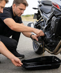 Two mechanics using a Heavy Duty Oil Drain Pan With Giant Capacity And Leak Proof Design for smooth auto repairs.