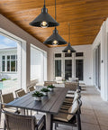 Heavy Duty Black Plug In Pendant Lights 2 Pack Industrial Hanging Lamps With 15 Foot Adjustable Cord And Switch over a dining table.