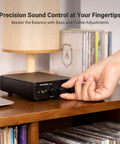 Hand adjusting controls on Beefy 2 Channel Class D Desktop Amplifier powered by TPA3255 with 600W total power, near records.