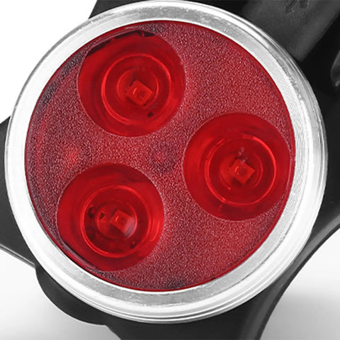 Close-up of red taillight in Two Pack USB Rechargeable Bike Lights Waterproof IP65 For Night Rides With Four Bright Modes Easy Install Mountain Bike Headlight LED Lamp And Taillight A Must Have Bicycle Accessory For Safe Night Cycling.