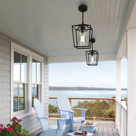 Black Farmhouse Kitchen Island Pendant Light With Metal Cage And Clear Glass Shade Giving Off Cozy Warm Vibes on porch ceiling