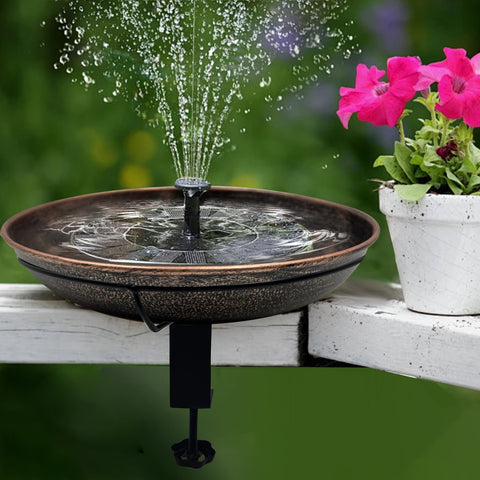 Deck Mounted Bird Bath With Detachable 12 Inch Bowl Thats A Breeze To Clean 0.7 Gallon Capacity Metal Bird Bath For Railings Balcony Fence Outdoors Adjustable Clamp Fits 0.5 To 3.5 Inch with water spray on railing next to pink flowers