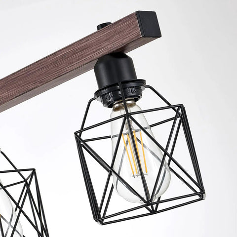 Close-up of three light vintage industrial pendant with walnut finish and matte black frame adjustable hanging light for kitchen island
