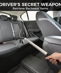 Using Bed Buddy Truck Tool Adjustable 16 To 37 Inch Cargo Grabber to retrieve items from a car backseat, showcasing sturdy steel hook.