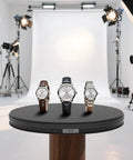 Super Smooth Electric Turntable For Product Photography displaying three elegant watches on a black rotating display stand.