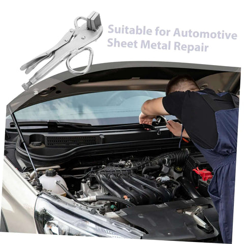 Mechanic using heavy duty pulling pliers clamp for auto body sheet metal repair under car hood
