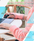 Person wearing pink breathable carpal tunnel wrist brace with 2 adjustable straps, using laptop, right hand.