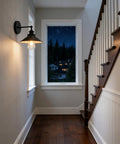 Black Industrial Wall Sconce With 8.1 Inch Metal Shade Vintage Retro Vibe 1 Light Wall Lamp installed in hallway during evening.