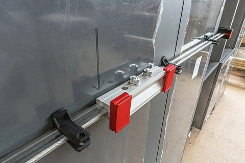 Heavy Duty K Body Revo Clamp Kit With 24 And 40 Inch Models, showing steel tracks and locked jaws for secure grip.