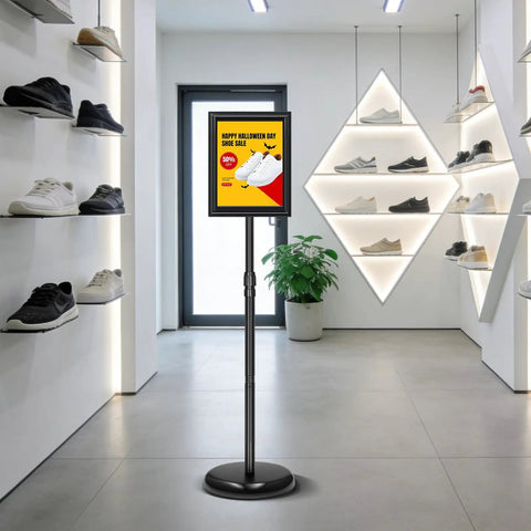 Two Pack Adjustable Floor Sign Stand 8.5 By 11 Inch Poster Holder with 360 Degree Rotating Frame in a shoe store displaying a sale ad
