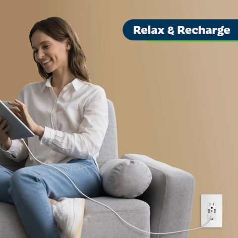 Woman relaxing on couch with tablet, charging via 4.2A Go-To 3 Port USB Wall Outlet With Type C And Type A Ports 15 Amp Receptacle
