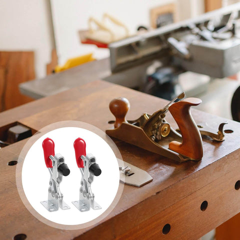 10 Piece Quick Toggle Clamps Set For Vertical Downward Push Heavy Duty Hold Downs For Woodworking And Welding Desktop Clamp Tool Anti Rust Finish Easy Lever Action Rock Solid For Assembly Jigs And Fixtures on a wooden workbench with woodworking tools.