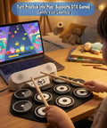Kid Friendly 9 Pad Electric Drum Set For Beginners with DTX Games support, child playing with roll-up silicone drum kit on a desk