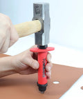 Hollow Punch Kit With Pinpoint Punch Shaft And Gasket Cutter Set, used for precise cutting in leather, shown in action with hammer.