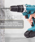 Side view of teal cordless drill with twist bit drilling into concrete wall; black chuck and battery pack